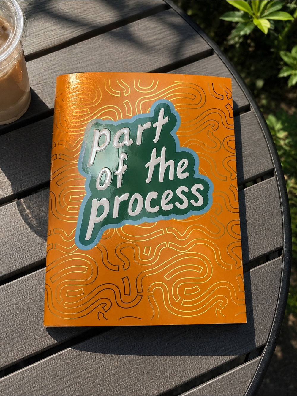 Orange Notebook with 'part of the process' Green Graphic
